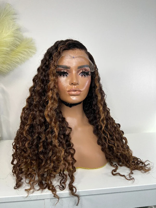 Curly wig with a pre - bleached knot for a natural - looking scalpNATURAL BROWN WITH SANDY HIGHLIGHTS BURMESE  CURLY 7x7 CLOSURE