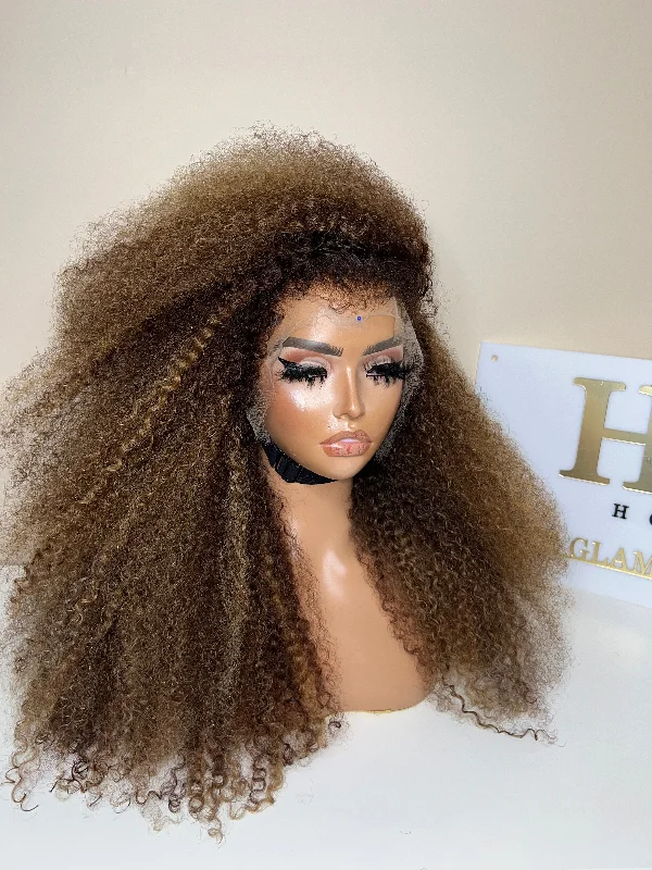 Curly wig with a wavy fringe for a soft and feminine lookREADY TO SHIP 13*6 LACE FRONTAL KINKY CURLY ASH BLONDE HIGHLIGHTS WITH VENTILATED 4C EDGES.